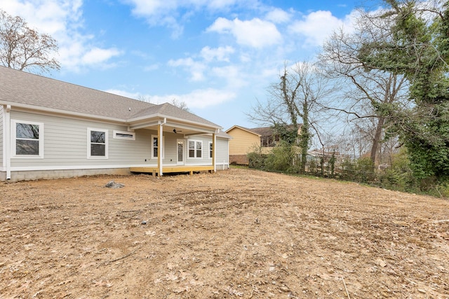 rear view of house with a wooden deck