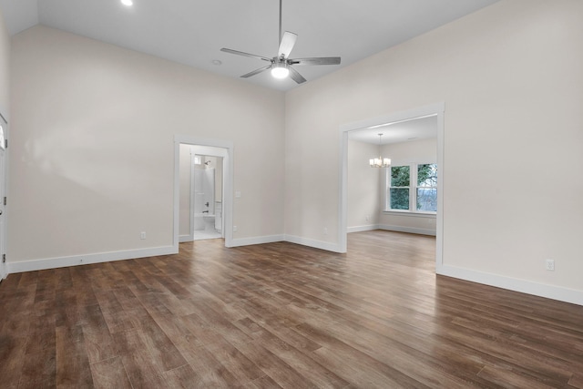 unfurnished room with lofted ceiling, hardwood / wood-style floors, and ceiling fan with notable chandelier