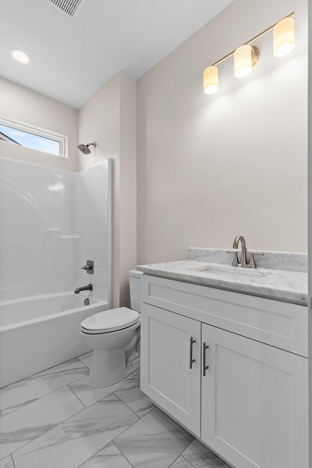 full bathroom with shower / tub combination, vanity, and toilet