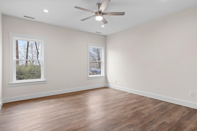 unfurnished room with ceiling fan and light hardwood / wood-style floors