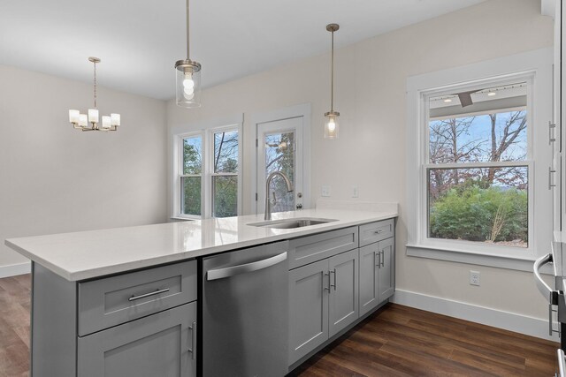 kitchen with kitchen peninsula, dishwasher, gray cabinets, and sink