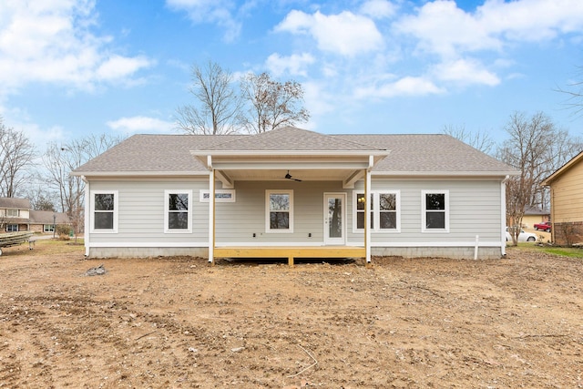 rear view of property with ceiling fan and covered porch