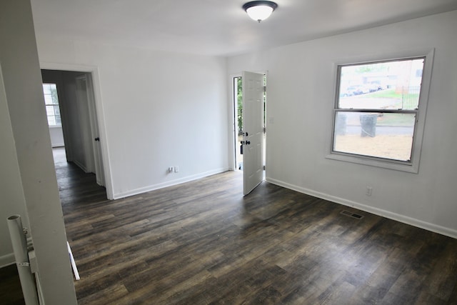 unfurnished room featuring dark hardwood / wood-style floors