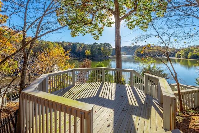 wooden deck featuring a water view