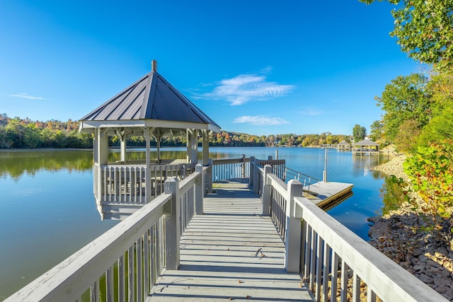 dock area featuring a gazebo and a water view