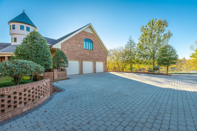 view of property exterior with a garage