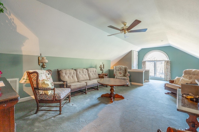 carpeted living room featuring ceiling fan and vaulted ceiling