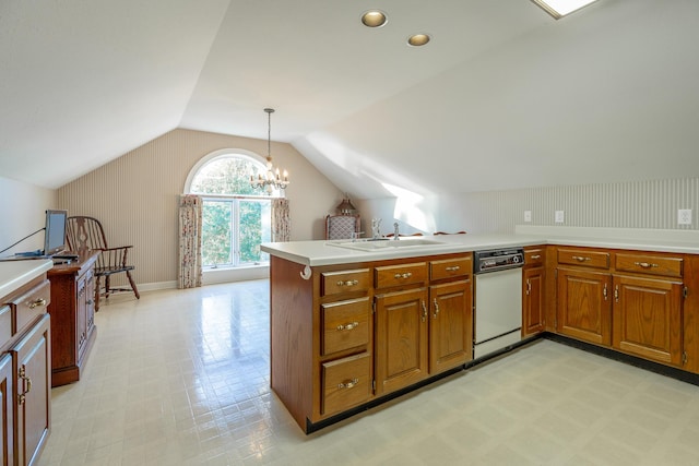 kitchen with kitchen peninsula, hanging light fixtures, lofted ceiling, and sink