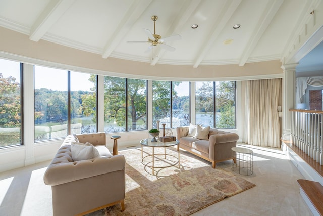 sunroom with beamed ceiling, ceiling fan, and ornate columns