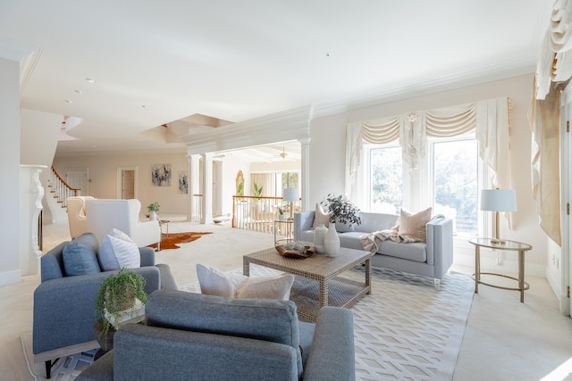 carpeted living room with ceiling fan and ornamental molding