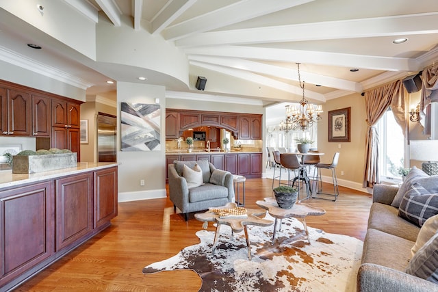 living room featuring vaulted ceiling with beams, light wood-type flooring, and a notable chandelier