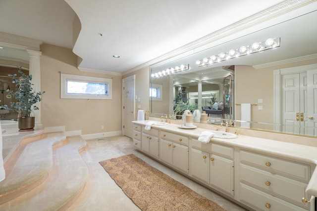 bathroom with vanity and ornamental molding