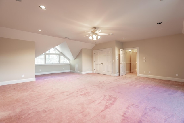 bonus room with ceiling fan, light carpet, and vaulted ceiling