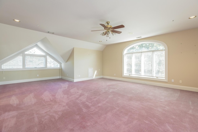 bonus room featuring light colored carpet, vaulted ceiling, and ceiling fan