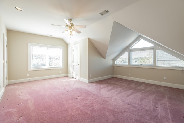 bonus room with ceiling fan, light colored carpet, and lofted ceiling