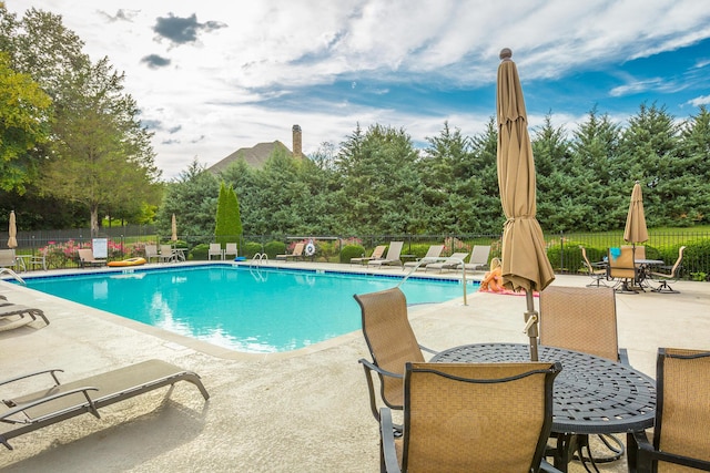 view of swimming pool featuring a patio