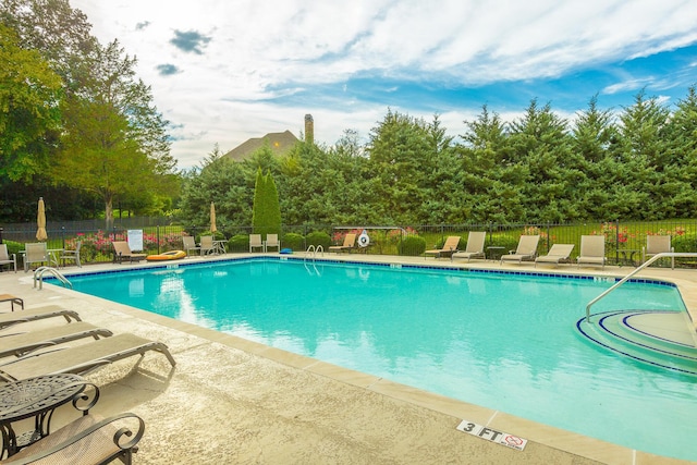 view of swimming pool featuring a patio