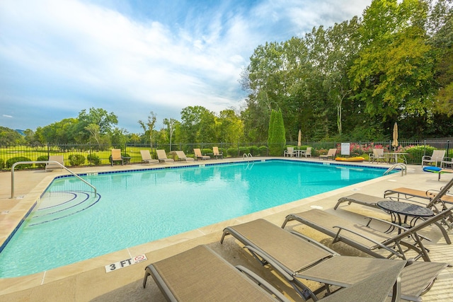 view of pool featuring a patio