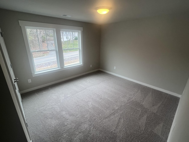 unfurnished room with carpet flooring