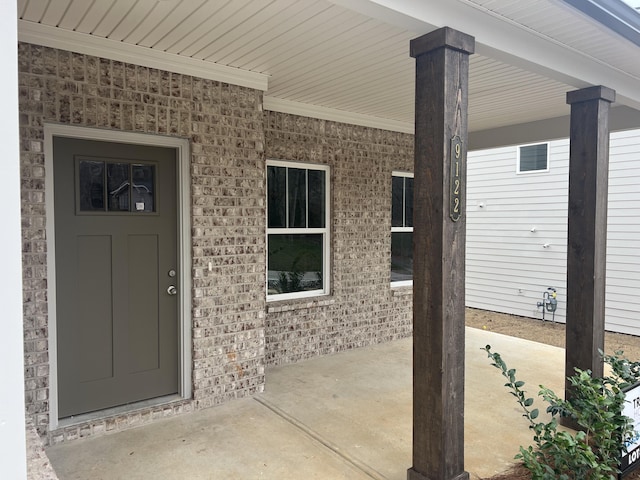 doorway to property featuring a porch