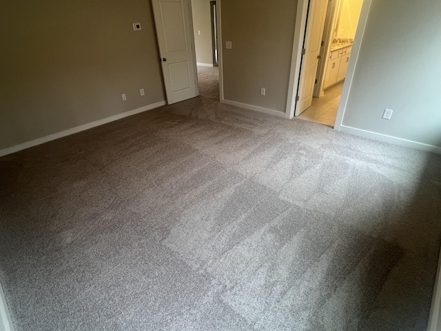 spare room with light colored carpet