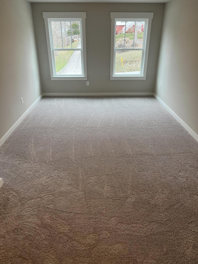 unfurnished room with light carpet