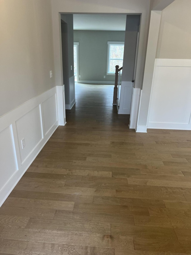 hall with dark hardwood / wood-style flooring