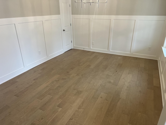 unfurnished room featuring hardwood / wood-style floors