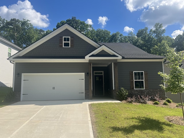 craftsman-style house with a front yard