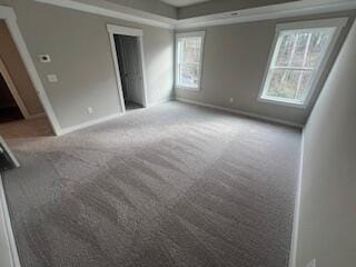 interior space featuring carpet flooring and multiple windows