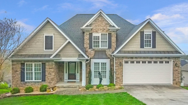 craftsman-style house with covered porch and a garage