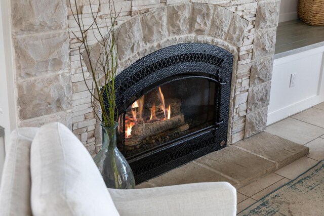 interior details with a stone fireplace