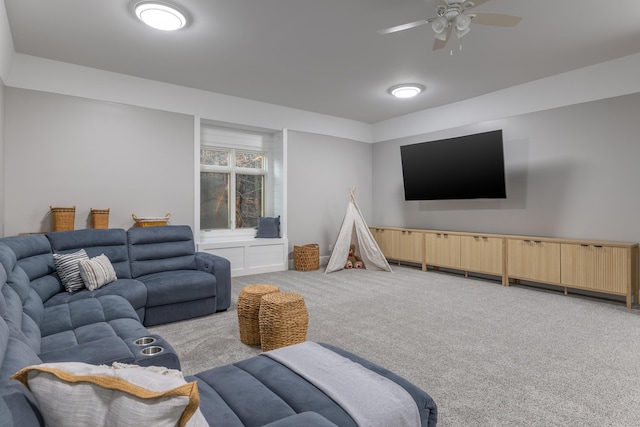 living area featuring light carpet and a ceiling fan