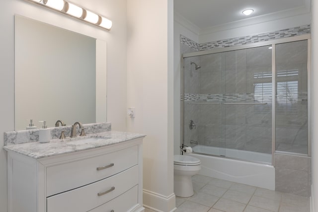 full bath featuring tile patterned floors, toilet, combined bath / shower with glass door, crown molding, and vanity