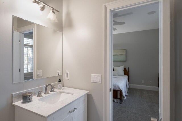 bathroom with vanity and baseboards