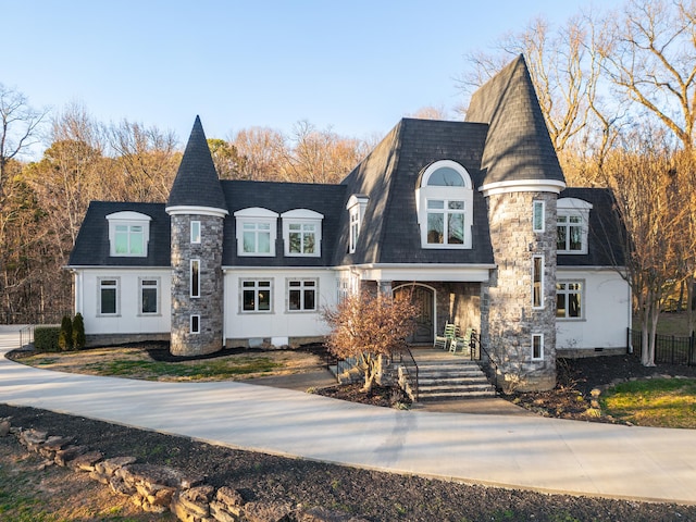 view of front of house featuring a shingled roof, fence, and crawl space