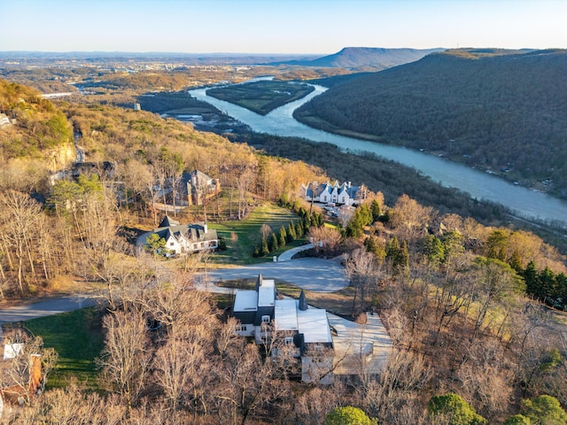 bird's eye view featuring a water and mountain view and a view of trees