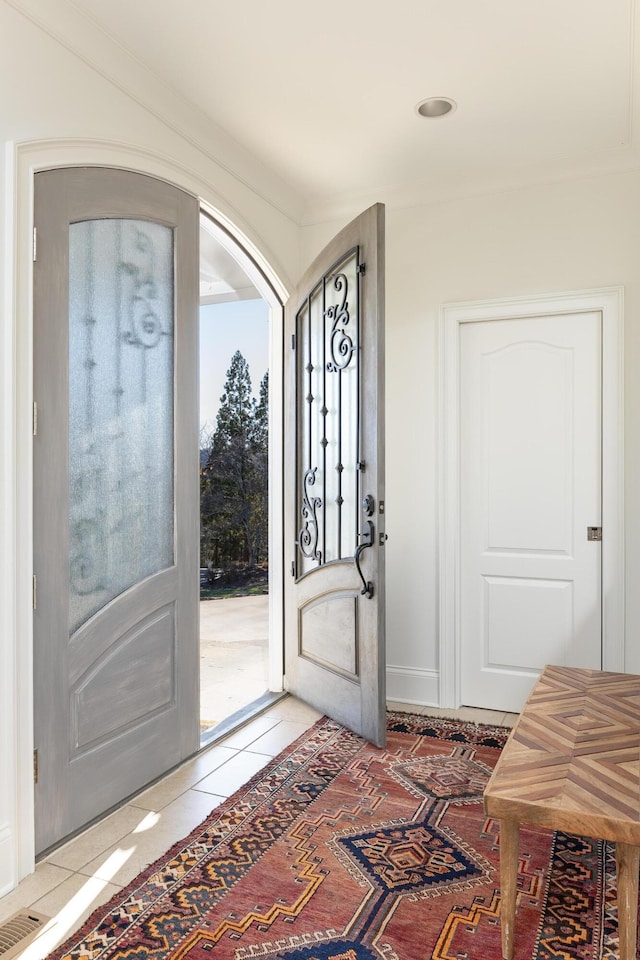 entrance foyer with visible vents and light tile patterned flooring