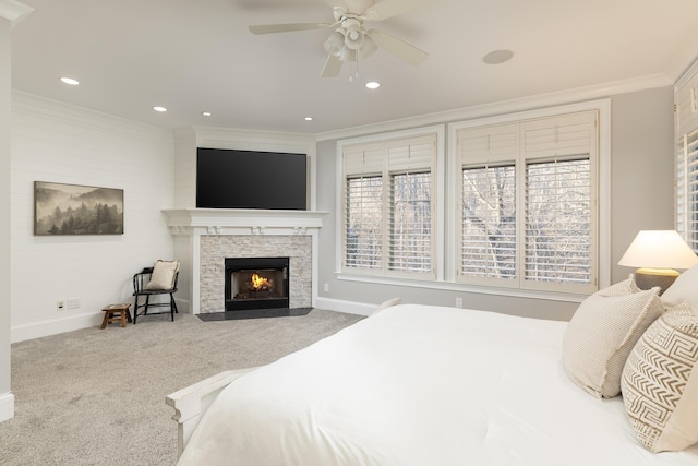 carpeted bedroom featuring baseboards, multiple windows, and ornamental molding