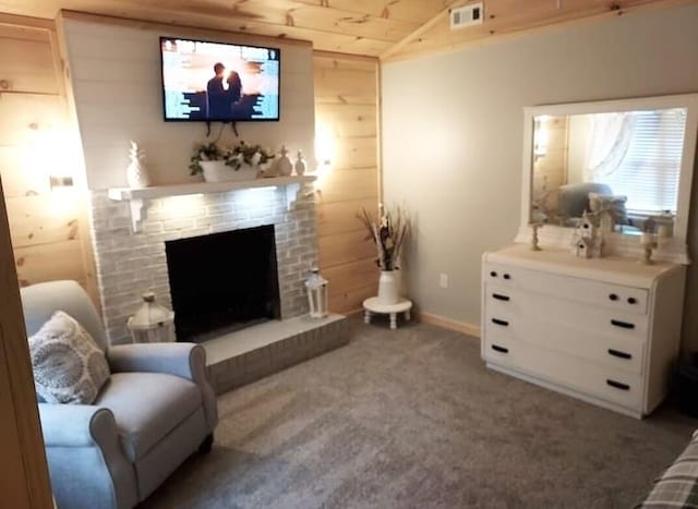 living room with carpet flooring, wood ceiling, a fireplace, lofted ceiling, and wood walls