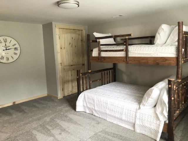 bedroom featuring dark colored carpet