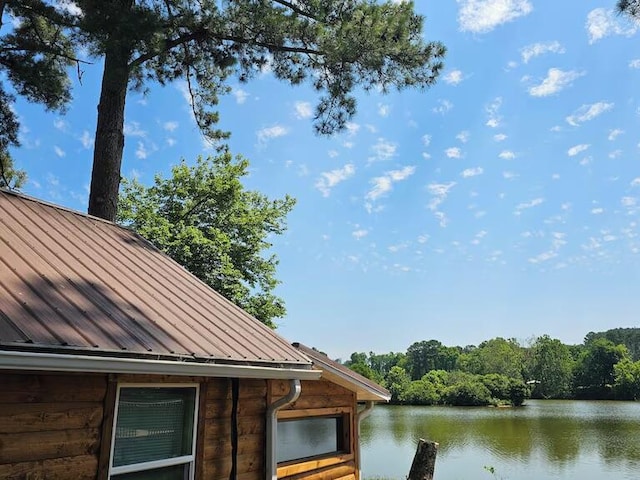 exterior space with a water view