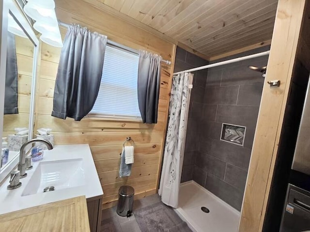 bathroom featuring a shower with curtain, vanity, wood walls, and wooden ceiling