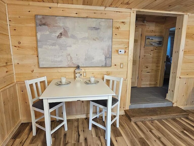 dining area with wooden walls