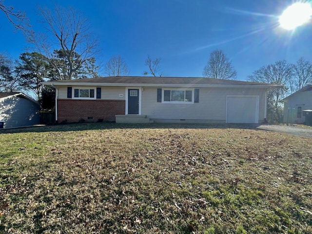 single story home with a front yard and a garage