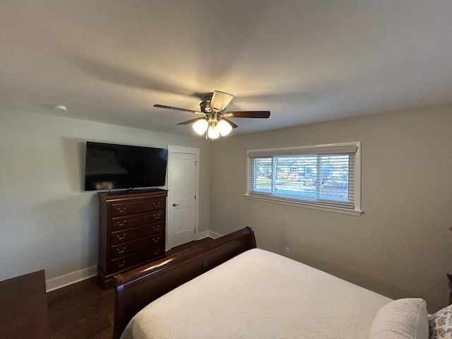 bedroom featuring ceiling fan and dark wood-type flooring