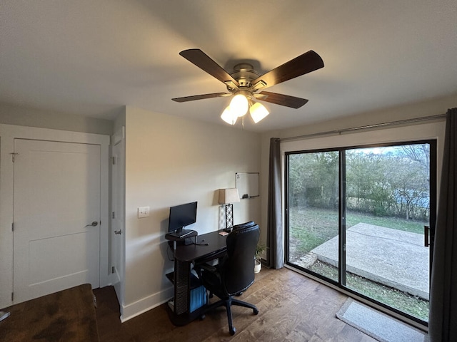 office with wood-type flooring and ceiling fan