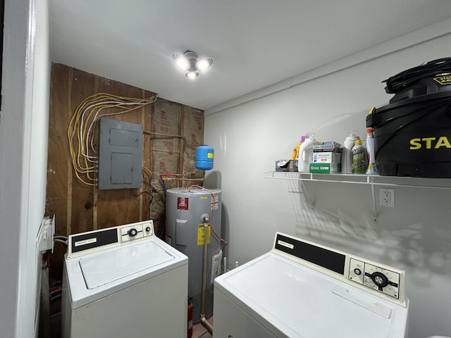 washroom with washer and clothes dryer, electric panel, and water heater