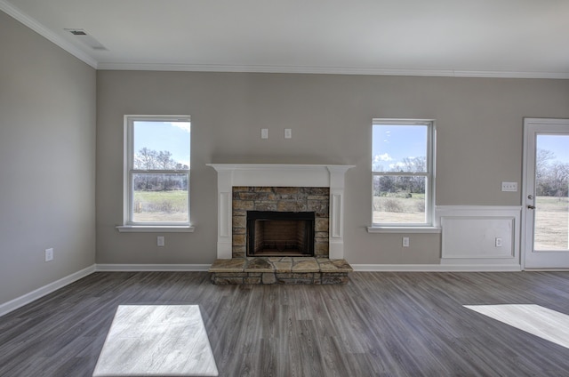 unfurnished living room with a fireplace, dark hardwood / wood-style flooring, and ornamental molding