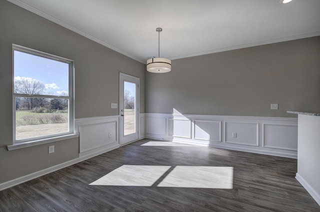 spare room with dark hardwood / wood-style floors and crown molding